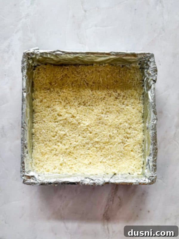 Decadent Coconut Macaroon Blondies 11 Spreading macaroon mixture over blondie batter