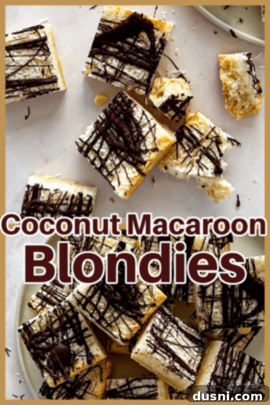 Decadent Coconut Macaroon Blondies 14 Side view of Coconut Macaroon Blondies stacked on a plate