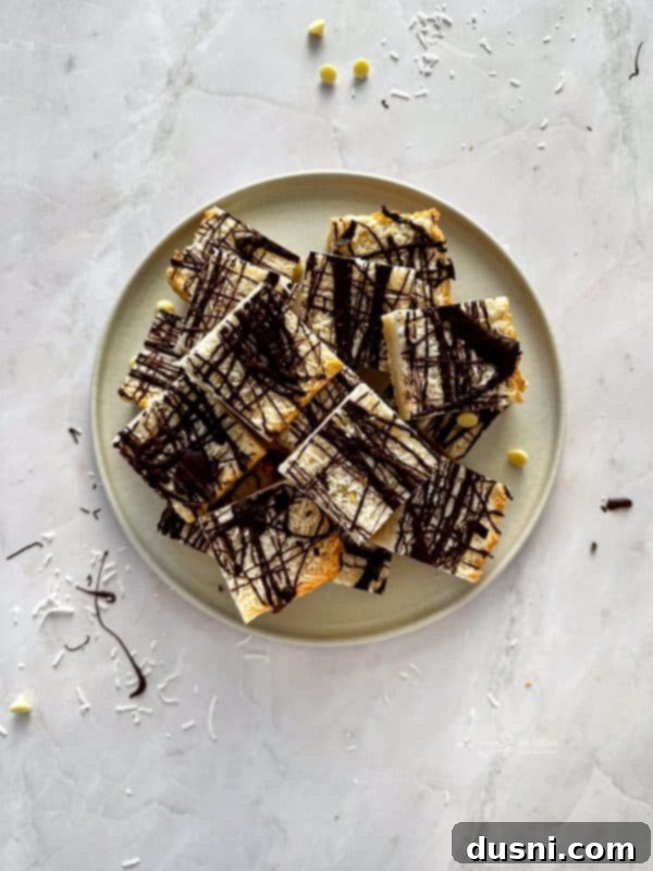 Decadent Coconut Macaroon Blondies 15 Platter of Coconut Macaroon Blondies with a fork