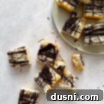 Decadent Coconut Macaroon Blondies 20 Coconut Macaroon Blondies on a plate and on a a table