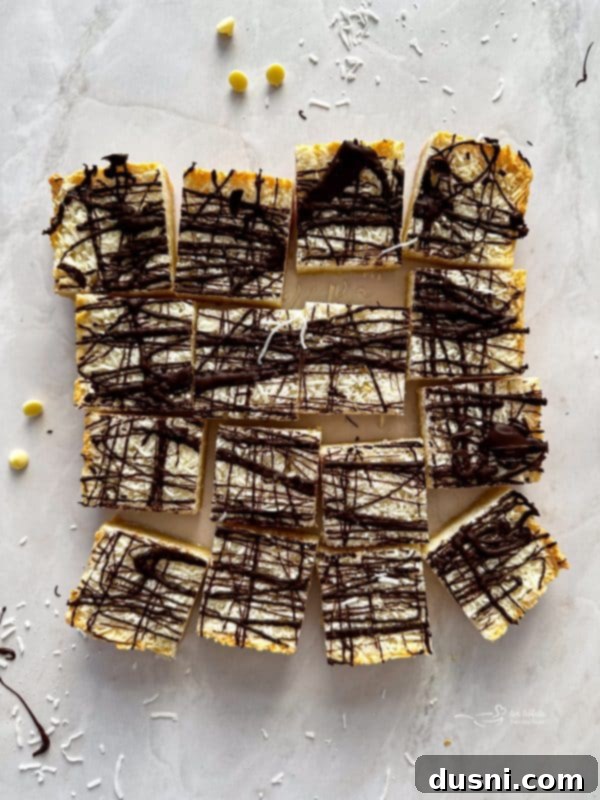 Decadent Coconut Macaroon Blondies 5 Close-up of individual Coconut Macaroon Blondies on a cooling rack