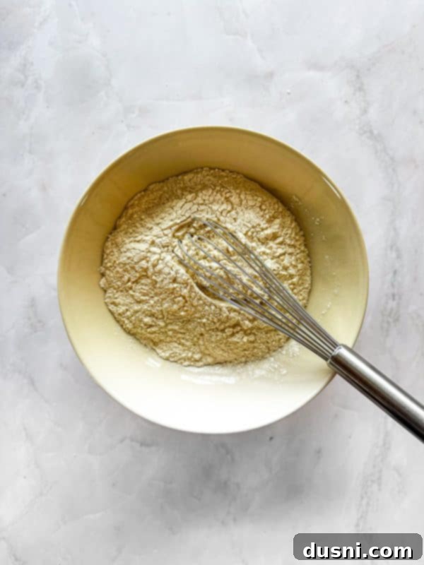 Decadent Coconut Macaroon Blondies 6 Mixing dry ingredients for Coconut Macaroon Blondies