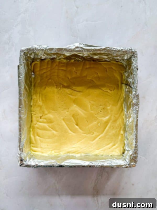 Decadent Coconut Macaroon Blondies 8 Pressing blondie batter into a prepared pan