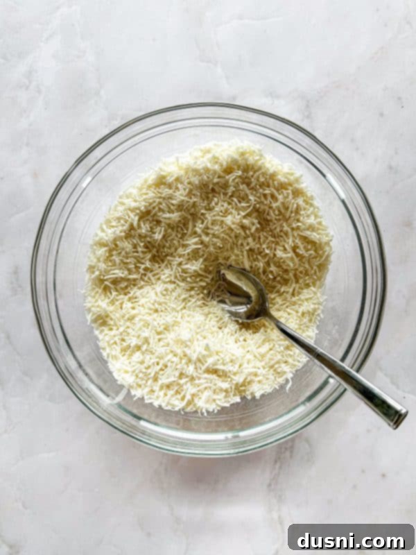 Decadent Coconut Macaroon Blondies 9 Close-up of blondie base pressed into baking pan