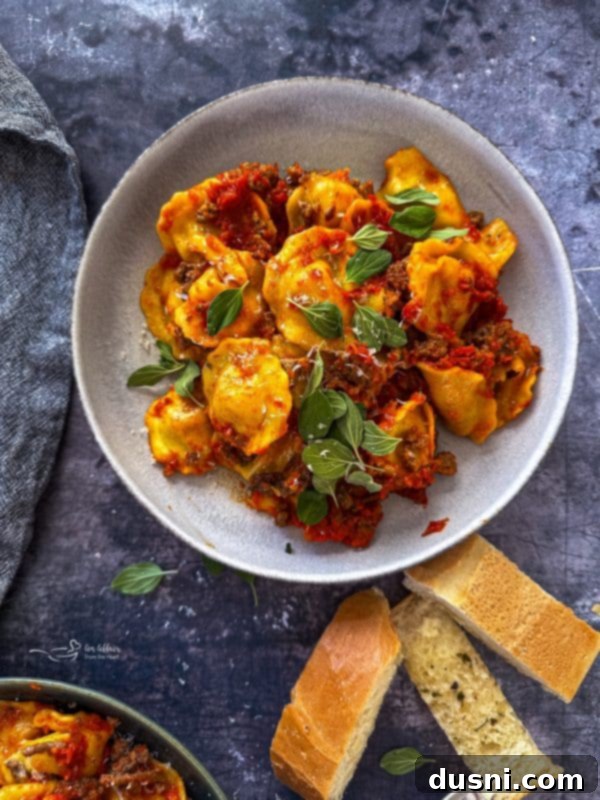 Lazy Slow Cooker Ravioli Lasagna 2 Delicious Slow Cooker Ravioli Lasagna in a Crockpot, ready to be served.