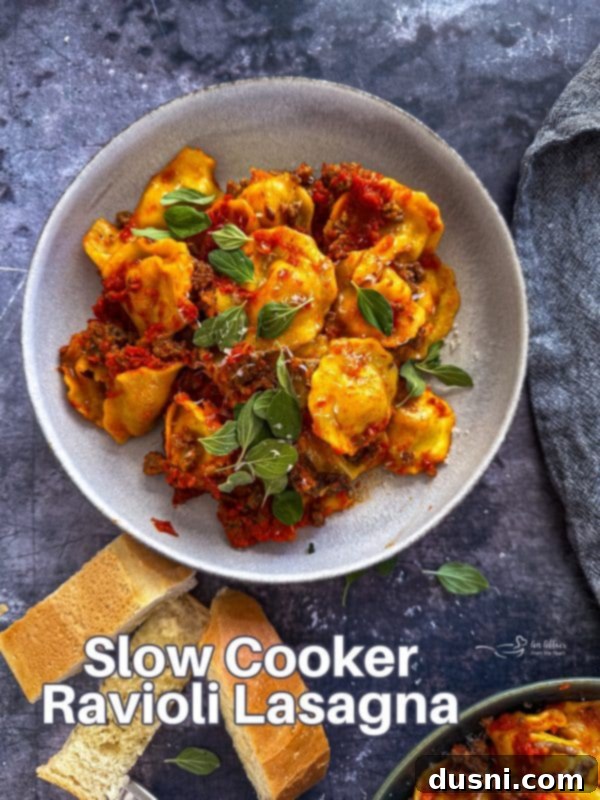 Lazy Slow Cooker Ravioli Lasagna 17 Hero shot of the finished Slow Cooker Ravioli Lasagna on a serving plate.