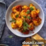 Lazy Slow Cooker Ravioli Lasagna 19 Slow Cooker Ravioli Lasagna on a white plate, close up.