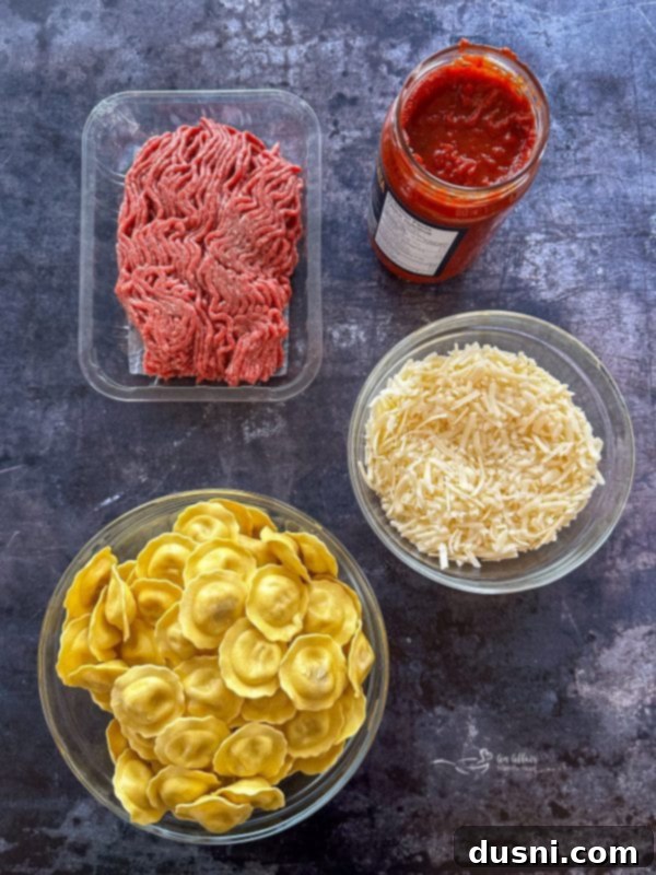 Lazy Slow Cooker Ravioli Lasagna 5 Slow Cooker Ravioli Lasagna being spooned onto a plate, showcasing its layers.