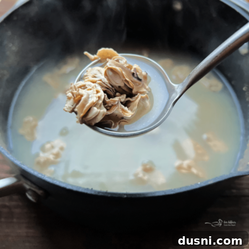 Velvety Oyster Stew 8 Beginning the oyster stew: adding fresh oysters and their liquid to a pot.