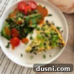 Dorothy's Hearty Bacon & Potato Frittata 19 Slice of Bacon & Potato Frittata and a side salad on a white plate