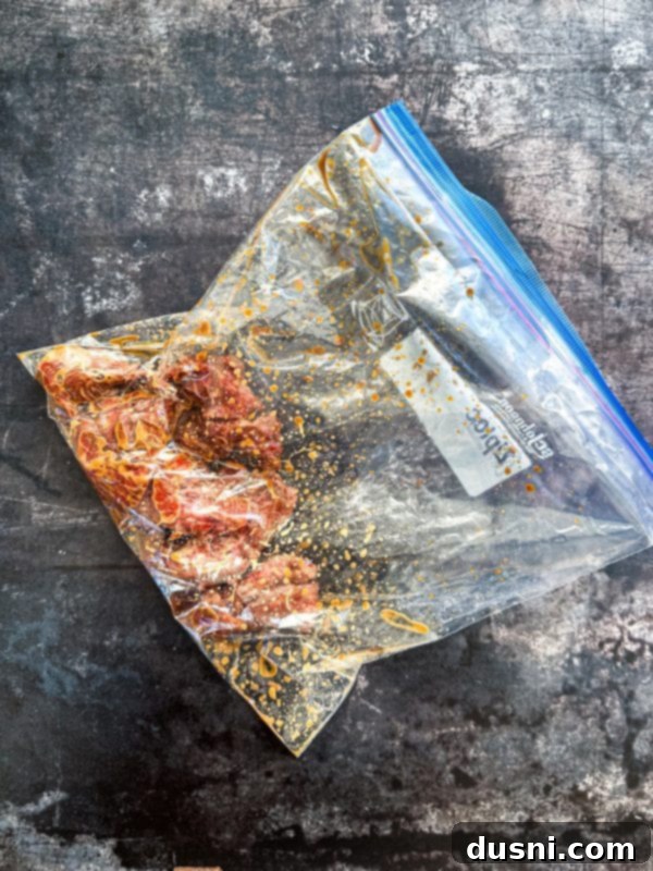 Savory Beef Lo Mein 8 A closer view of the marinated beef inside the zip-top bag, showing it fully coated.