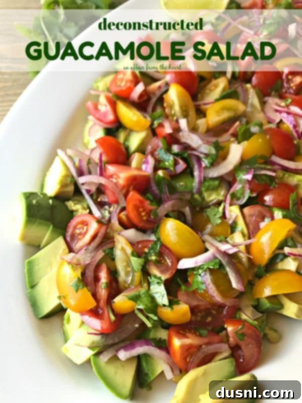 The finished Deconstructed Guacamole Salad served on a rustic plate, garnished with fresh cilantro, ready to be enjoyed.