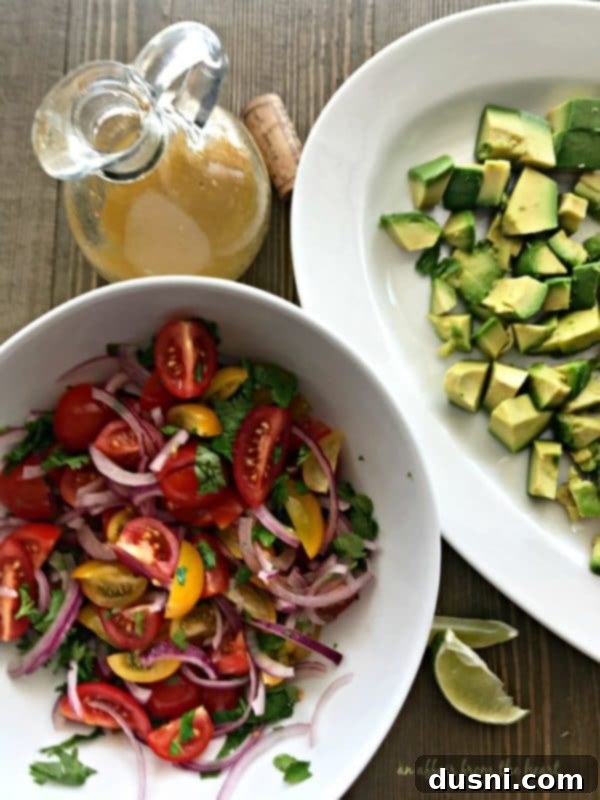 Close-up of the simple lime dressing ingredients: fresh lime juice, hot sauce, apple cider vinegar, and extra virgin olive oil.