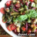 Vibrant Italian Bean Salad 13 Overhead of Italian bean salad in a white bowl