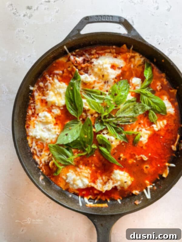 Skillet lasagna bubbling on the stove