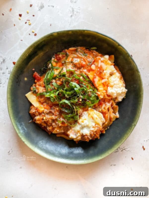 Skillet lasagna simmering in a pan