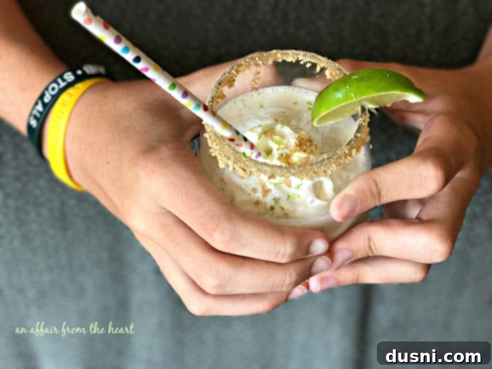 Zesty Key Lime Delight 10 Two glasses of Key Lime Pie Smoothie on a table, ready to be enjoyed.