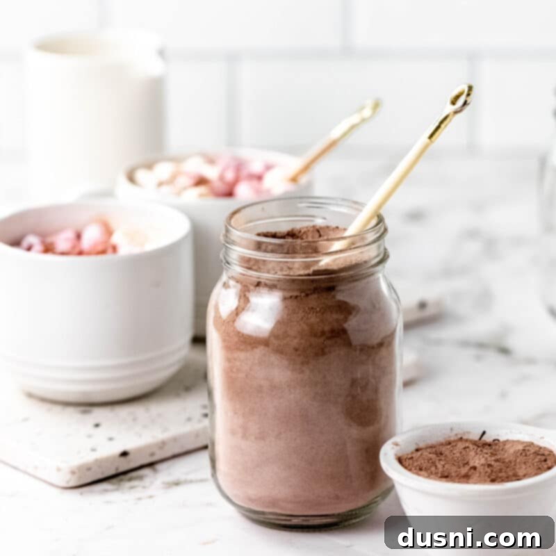 Cozy Homemade Cocoa Blend 11 A beautifully packaged mason jar of homemade hot cocoa mix with a tag and a rustic wooden background.