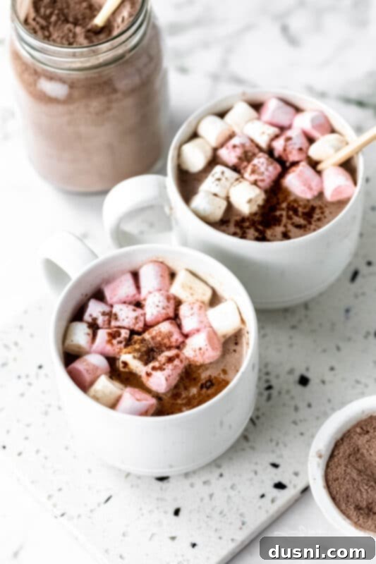 Cozy Homemade Cocoa Blend 4 Close-up of three ingredients – powdered sugar, powdered milk, and cocoa powder – in separate small bowls, ready to be combined.