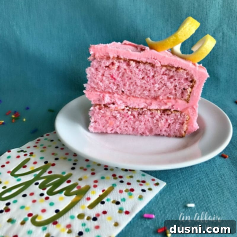 Blush Citrus Dream 8 Pink Lemonade Cake with a single slice on a white plate