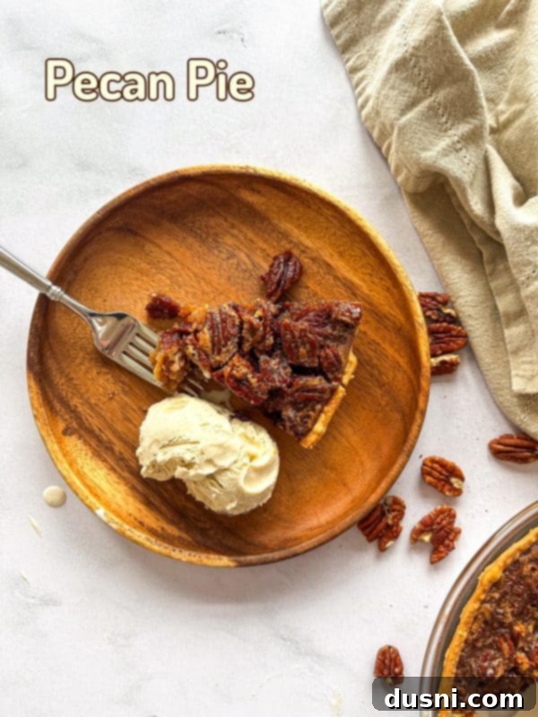 A beautifully baked pecan pie with a golden crust and pecan topping.