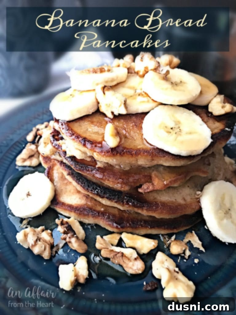 Banana Bread Bliss Stacks 9 A towering stack of Banana Bread Pancakes, garnished with fresh banana slices and walnuts, ready to be served.