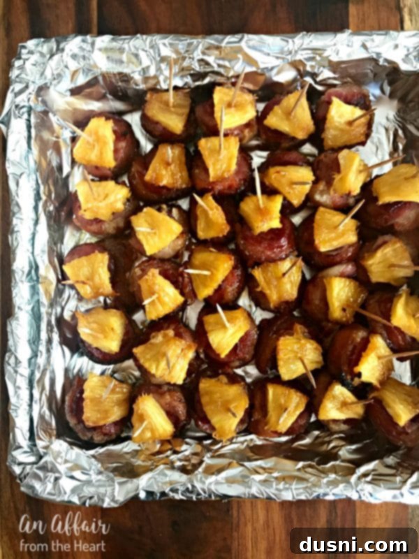 Aloha Bacon Wrapped Sausage Poppers 13 Aloha Bacon Wrapped Sausage Bites in a foil pan, ready for freezing or reheating