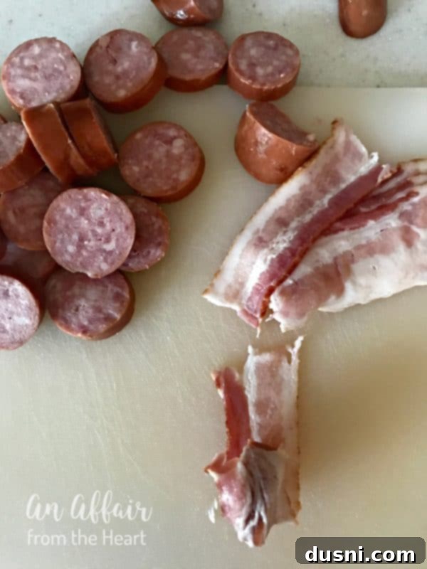 Aloha Bacon Wrapped Sausage Poppers 8 Sausage being wrapped in bacon for the Aloha Bacon Wrapped Sausage Bites recipe