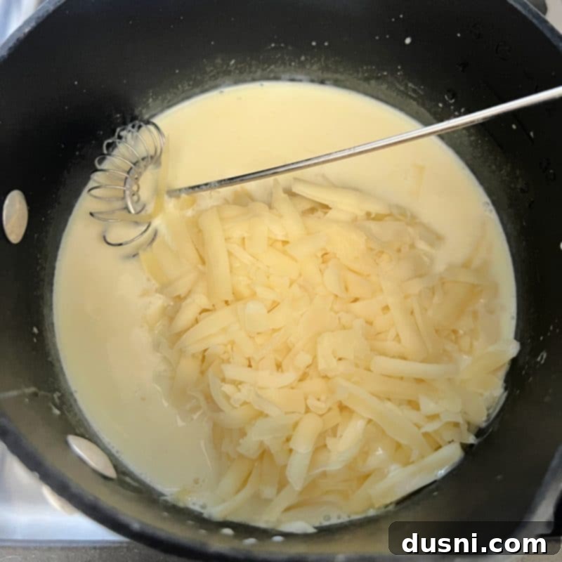 Loaded Reuben Nachos 7 Melted butter and flour forming a roux in a saucepan, the first step for the Swiss cheese sauce