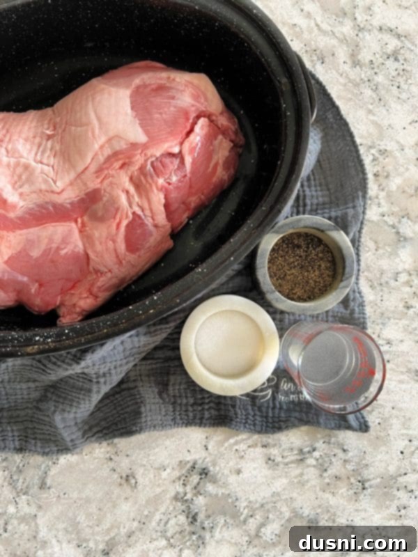 Closeup of a succulent pork roast, expertly seasoned and perfectly browned, resting on a cutting board, ready to be carved.