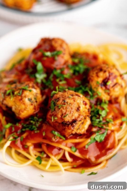 Crispy Air Fryer Turkey Meatballs 14 Air fried turkey meatballs in the air fryer basket.