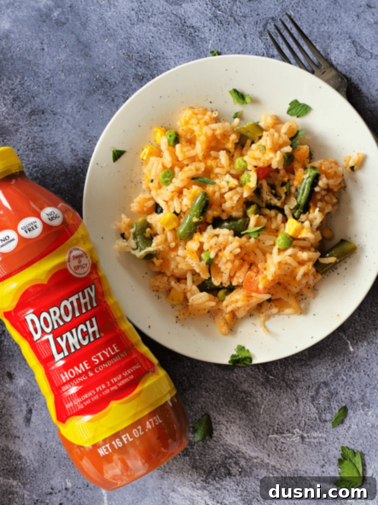 Dorothy's Golden Cheesy Vegetable Rice Bake 3 A casserole dish filled with Dorothy's Cheesy Vegetable Rice Bake, ready to be served.