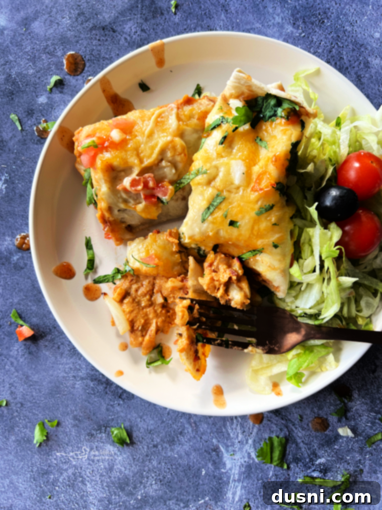 Five Bean and Cheese Enchiladas baked in a casserole dish