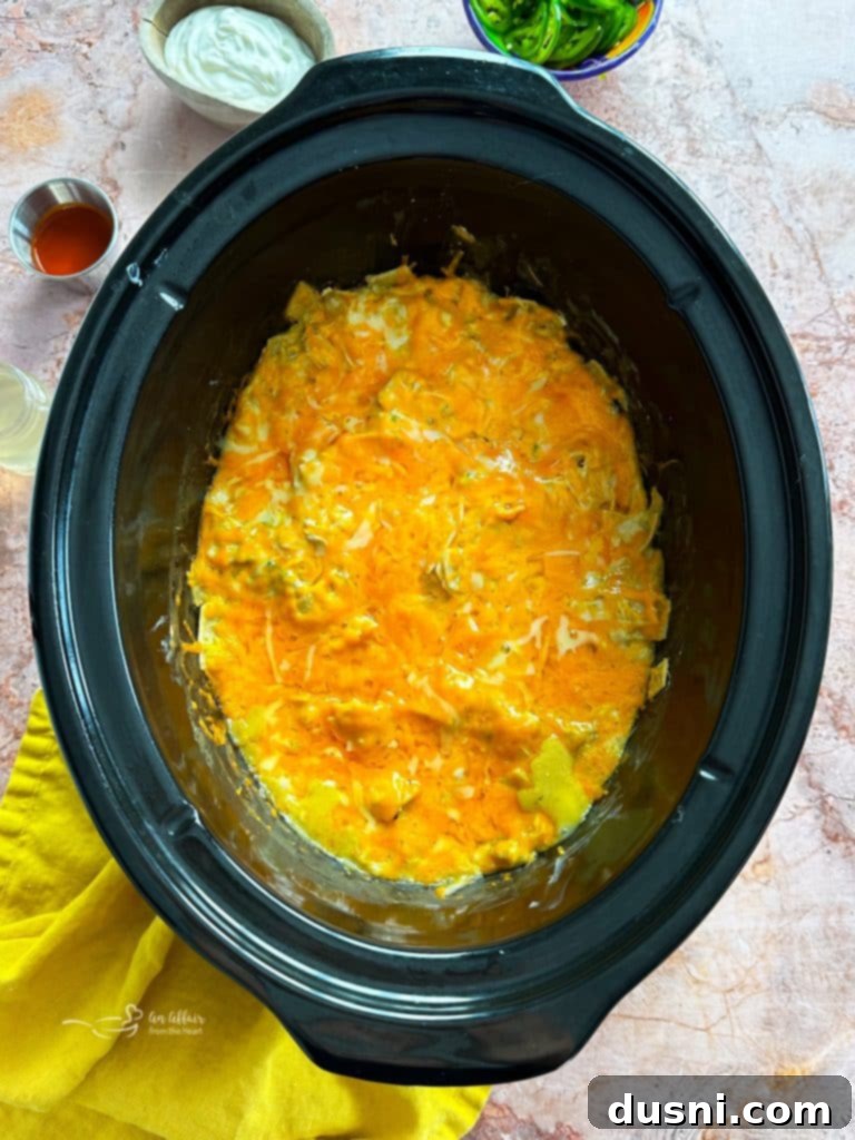 Slow Cooker Green Chile Chicken Enchilada Casserole in the slow cooker