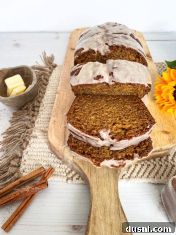Pumpkin Patch Zucchini Crumble Loaf 19 A loaf of classic pumpkin bread, sliced.