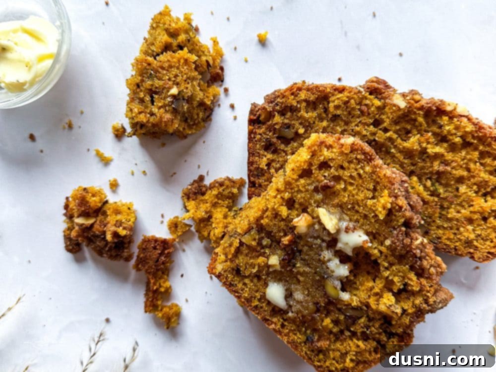 Pumpkin Patch Zucchini Crumble Loaf 5 Close-up of a loaf of Pumpkin Zucchini Streusel Bread with a generous streusel topping.