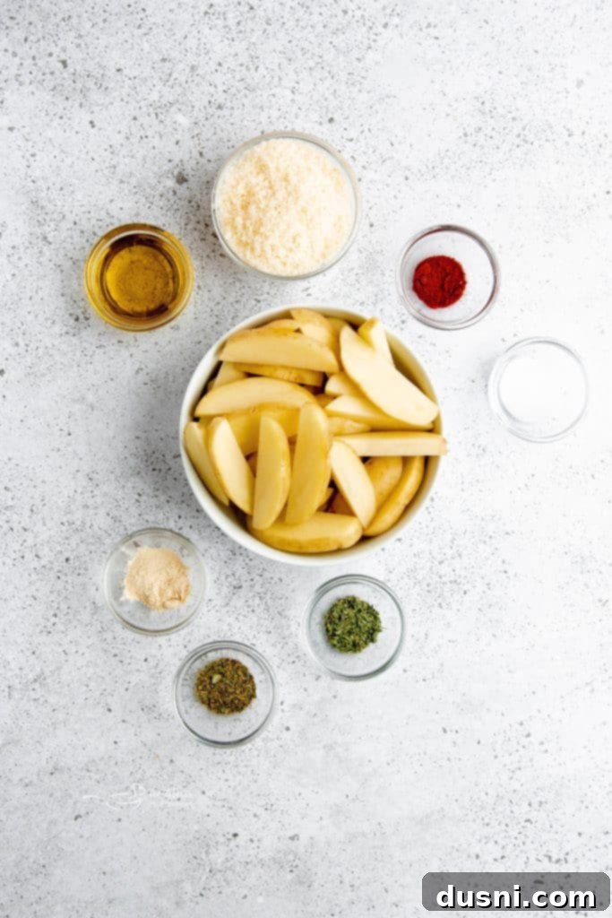 A close-up shot of individual crispy roasted potato wedges garnished with fresh parsley.