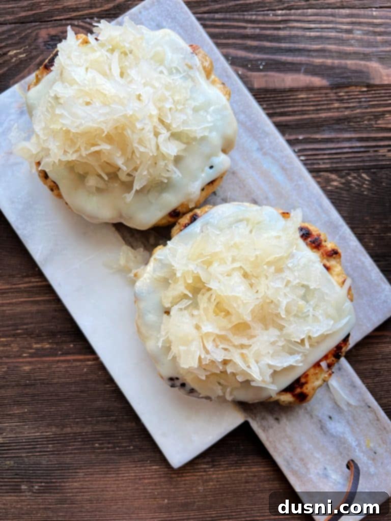 Toasted hamburger buns, buttered and golden brown.
