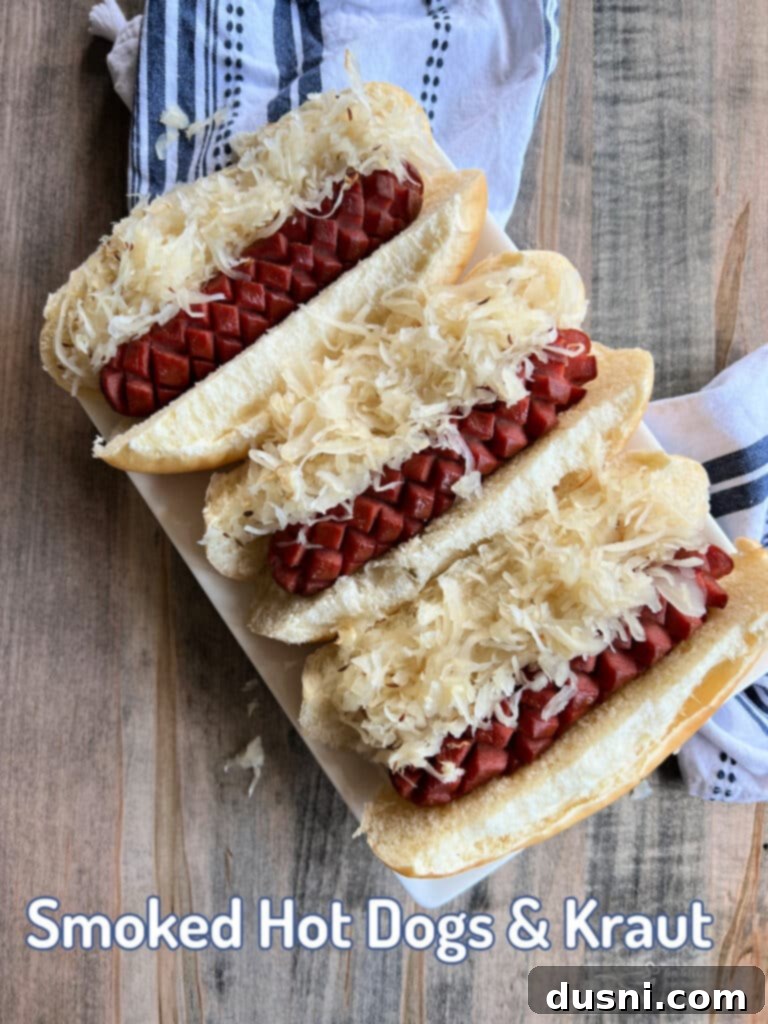Smoked Hot Dogs & Kraut served in buns on a rustic serving platter.
