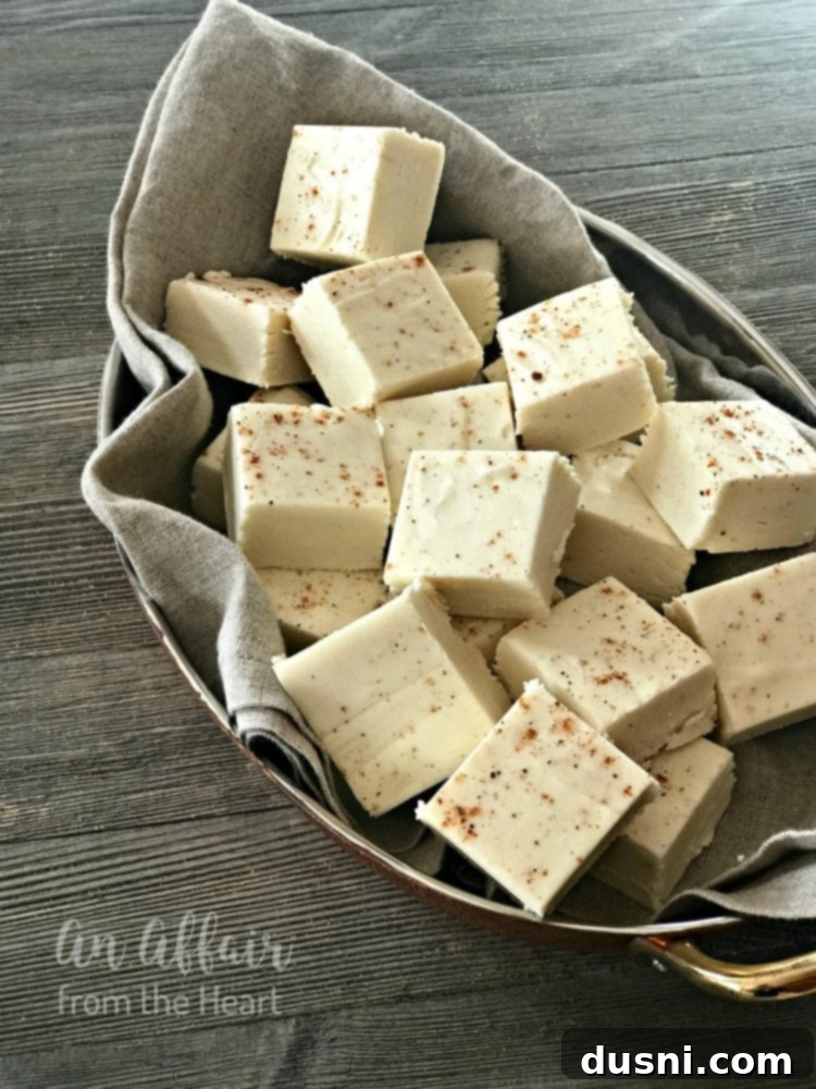 Yuletide Eggnog Bliss 8 A cozy scene with eggnog fudge, a book, and a warm beverage, perfect for enjoying the holidays.