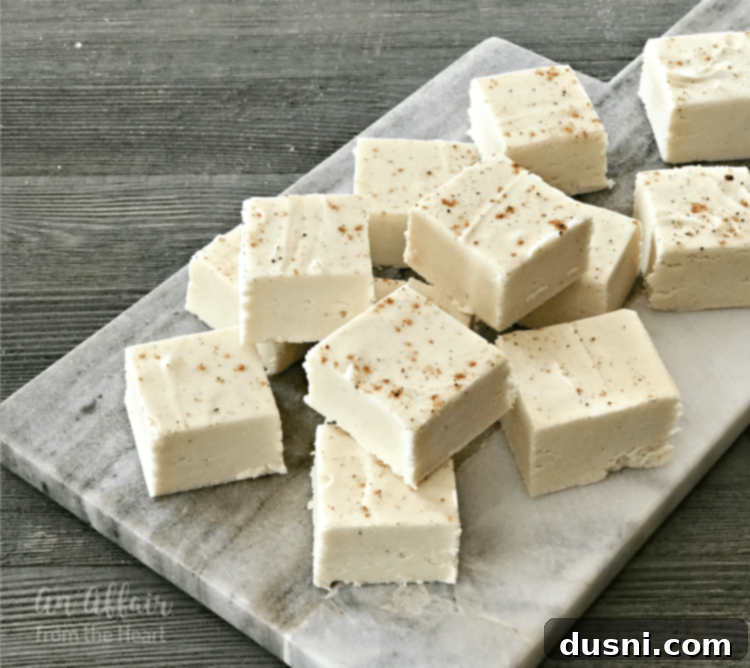 Yuletide Eggnog Bliss 4 Eggnog fudge squares neatly arranged, highlighting their perfect shape and inviting appeal.