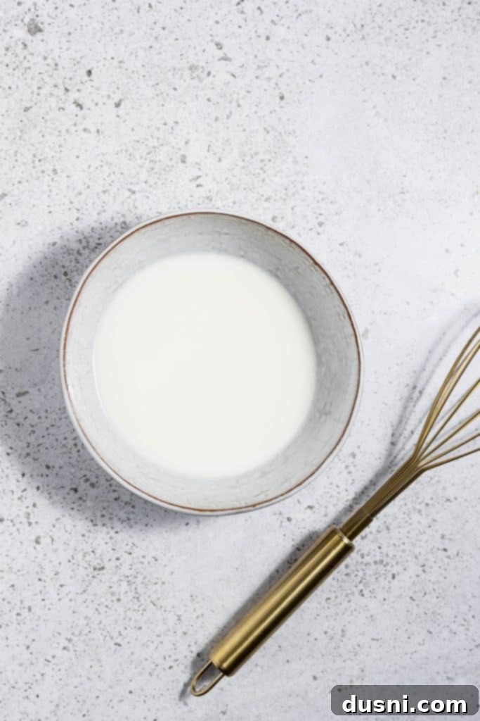 Effortless Slow Cooker Chicken Marsala 9 Whisking cornstarch and water for slurry