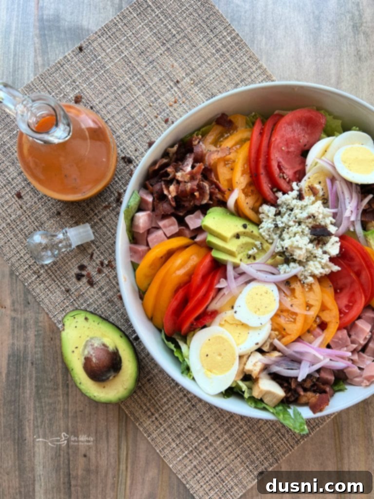Summer's Crisp Cobb 11 A bountiful Summertime Cobb Salad, showcasing its rich textures and colors.