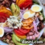 Summer's Crisp Cobb 16 Extreme close up of all the delicious ingredients placed nicely in a white bowl.