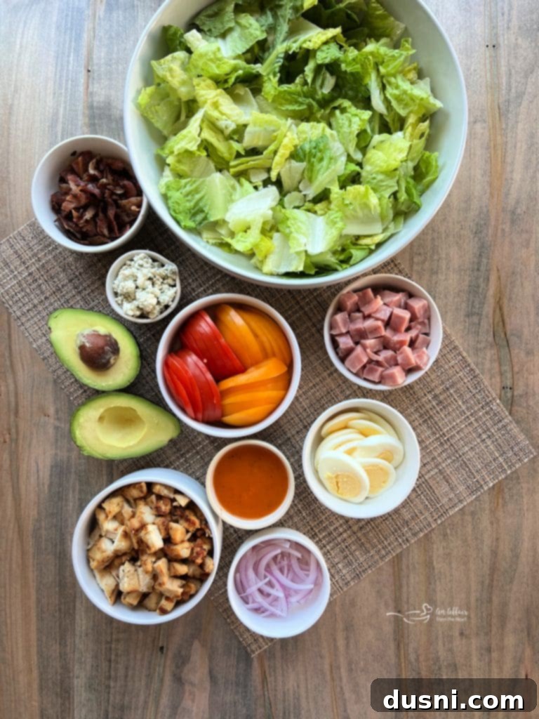 Summer's Crisp Cobb 4 A close-up of the delicious ingredients of Summertime Cobb Salad artfully arranged in a bowl.
