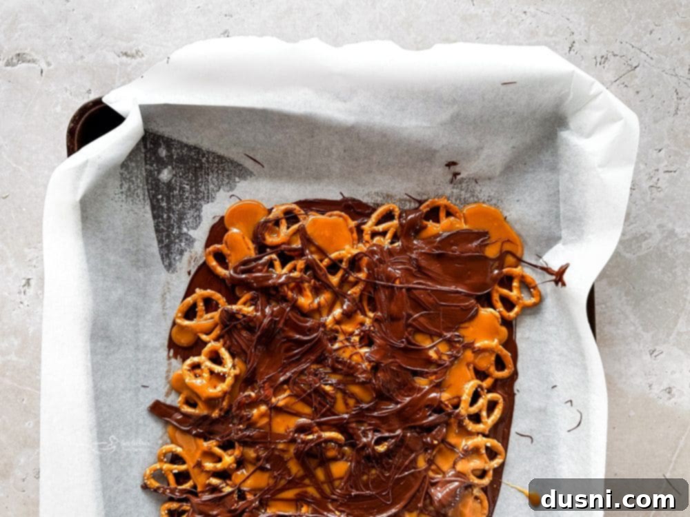 Step 4: Pouring melted caramel over the pretzel layer