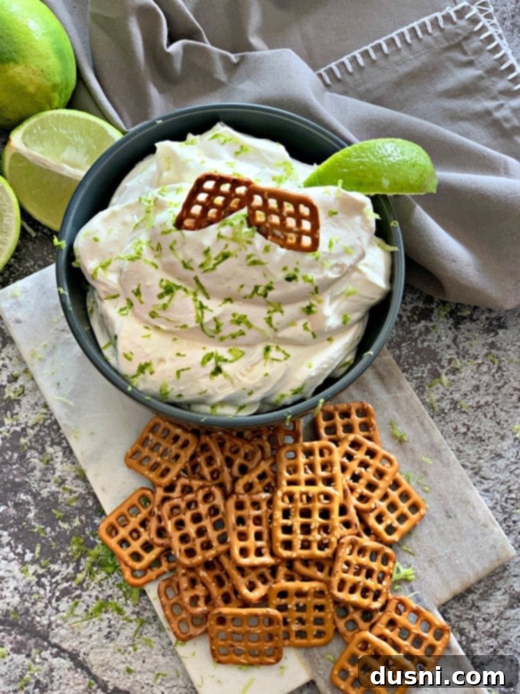 Irresistible Dips for Every Occasion 30 Overhead view of Margarita Dip served with salted pretzels, a perfect sweet and salty combination.
