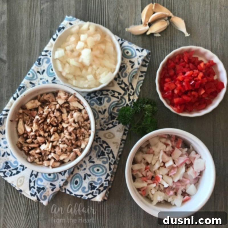 Creamy Surimi Stuffed Mushrooms 7 A cast iron skillet filled with uncooked stuffed mushrooms