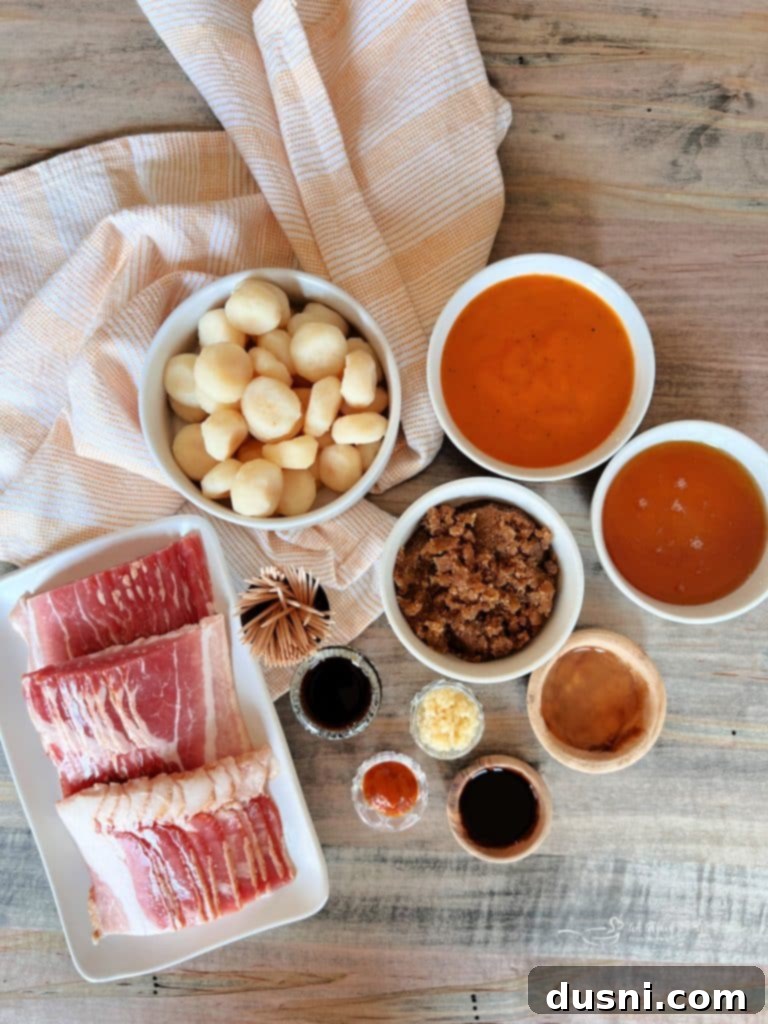 Close-up of a bowl of homemade Dorothy Lynch BBQ sauce with a whisk, surrounded by sauce ingredients.