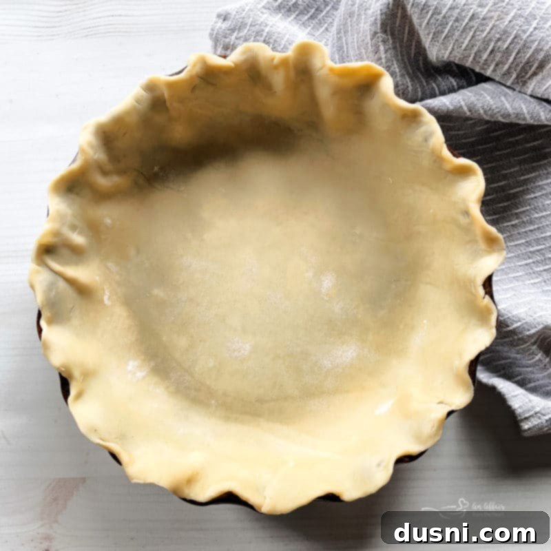 Pre-bake Your Pie Crust 4 Laying dough in pie plate for blind baking